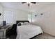 Main bedroom with king-size bed and home office at 2135 N Heritage St, Buckeye, AZ 85396