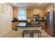 Modern kitchen featuring an island, ample cabinetry, and granite countertops at 2135 N Heritage St, Buckeye, AZ 85396