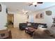 Spacious living room featuring a sectional sofa and tile floors at 2135 N Heritage St, Buckeye, AZ 85396