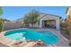 Refreshing kidney-shaped pool with waterfall and ample patio space at 2135 N Heritage St, Buckeye, AZ 85396