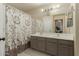 Bathroom with double vanity and a shower/tub combo at 24018 W Wayland Dr, Buckeye, AZ 85326