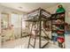 Bedroom with a loft bed, desk, and plenty of storage at 24018 W Wayland Dr, Buckeye, AZ 85326