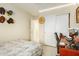 Bedroom with a double bed, desk, and built-in wardrobe at 24018 W Wayland Dr, Buckeye, AZ 85326