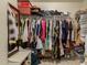 Large walk-in closet with ample hanging space and shelving at 24018 W Wayland Dr, Buckeye, AZ 85326