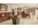 Bright dining room features a large wood table with leather chairs, and is open to the kitchen at 24018 W Wayland Dr, Buckeye, AZ 85326