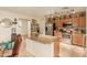 Kitchen boasts stainless steel appliances and an island with granite countertops at 24018 W Wayland Dr, Buckeye, AZ 85326