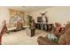 Living room with brown leather furniture and a large TV at 24018 W Wayland Dr, Buckeye, AZ 85326