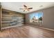 Bedroom with wood-look floors and a barn door at 29007 N 120Th Dr, Peoria, AZ 85383
