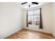 Light and airy bedroom with wood flooring and window coverings at 29007 N 120Th Dr, Peoria, AZ 85383