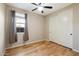 Bright bedroom featuring hardwood floors and double doors at 29007 N 120Th Dr, Peoria, AZ 85383