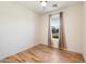 Spacious bedroom with hardwood floors and large window at 29007 N 120Th Dr, Peoria, AZ 85383