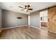 Spacious bedroom with wood flooring and ensuite bathroom access at 29007 N 120Th Dr, Peoria, AZ 85383