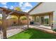 Patio area with pergola, grill, and brick pavers at 29007 N 120Th Dr, Peoria, AZ 85383