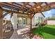 Wooden pergola covering patio area at 29007 N 120Th Dr, Peoria, AZ 85383