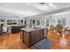 Open-concept kitchen and living area with hardwood floors and large windows at 3617 E Hazelwood St, Phoenix, AZ 85018