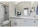 Clean bathroom with white vanity, marble tile shower, and modern fixtures at 3914 E Carson Rd, Phoenix, AZ 85042