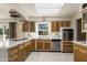 Modern kitchen with stainless steel appliances and wood cabinets at 4047 E Catalina Cir, Mesa, AZ 85206