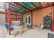 Relaxing backyard patio with pergola, seating, and smoker at 4541 W Federal Way, San Tan Valley, AZ 85144