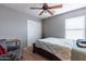 Bright bedroom with a double bed, ceiling fan and side chair at 4541 W Federal Way, San Tan Valley, AZ 85144