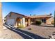 Single story home with a white garage door and rock landscaping at 4543 N 101St Ave, Phoenix, AZ 85037