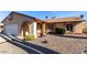 Single story home with a white garage door and rock landscaping at 4543 N 101St Ave, Phoenix, AZ 85037