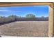 View of backyard through covered patio at 4689 E Argentite St, San Tan Valley, AZ 85143
