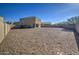 Large backyard with gravel and a partial view of the home at 4689 E Argentite St, San Tan Valley, AZ 85143