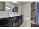 Bathroom with double vanity and walk-in shower at 4689 E Argentite St, San Tan Valley, AZ 85143