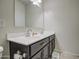 Bathroom with double vanity and dark brown cabinets at 4689 E Argentite St, San Tan Valley, AZ 85143