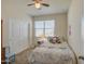 Bright bedroom with double door closet and window coverings at 4689 E Argentite St, San Tan Valley, AZ 85143