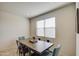 Bright dining area with a wood table and teal chairs at 4689 E Argentite St, San Tan Valley, AZ 85143