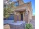 Two story house with dark brown pillars and gray door at 4689 E Argentite St, San Tan Valley, AZ 85143