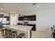 Spacious kitchen with an island and dark brown cabinets at 4689 E Argentite St, San Tan Valley, AZ 85143