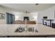 Kitchen island with granite countertop and double stainless steel sink at 4689 E Argentite St, San Tan Valley, AZ 85143