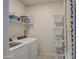 Laundry room with washer, dryer, shelving and storage at 4689 E Argentite St, San Tan Valley, AZ 85143