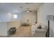 Loft with seating area, desk, and ceiling fan at 4689 E Argentite St, San Tan Valley, AZ 85143