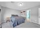 Bright bedroom with a comfortable bed and side table at 638 E Hinton Rd, Eloy, AZ 85131