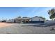 Mid-century modern home exterior with a landscaped front yard at 6528 E Bambi Dr, Mesa, AZ 85215