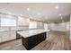 Renovated kitchen featuring a large island and white shaker cabinets at 6528 E Bambi Dr, Mesa, AZ 85215