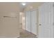 Hallway with double doors and additional storage at 66 W Hayden Park Rd, San Tan Valley, AZ 85143