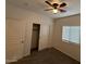 Bright bedroom with ceiling fan, closet, and window coverings at 6630 S 10Th Dr, Phoenix, AZ 85041