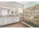 Modern bathroom with double vanity and large walk-in shower at 6898 W Saint John Rd, Glendale, AZ 85308