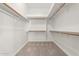 Large walk-in closet with ample shelving and hanging space at 6898 W Saint John Rd, Glendale, AZ 85308