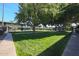 Neatly landscaped lawn with walkways, and apartment buildings in the background at 7141 N 16Th St # 231, Phoenix, AZ 85020