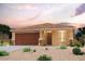 One-story home with two-car garage and desert landscaping at 7872 S John Jacob Astor Ave, Casa Grande, AZ 85193