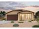 Charming single story home with two-car garage and desert landscaping at 7875 S Magic Dr, Casa Grande, AZ 85193