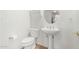 Clean and modern bathroom with a pedestal sink and toilet at 8139 N 13Th Way, Phoenix, AZ 85020