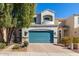 Two-story house with teal garage door and landscaped walkway at 8139 N 13Th Way, Phoenix, AZ 85020