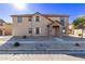 Two-story house with stone accents and a landscaped yard at 921 E Agua Fria Ln, Avondale, AZ 85323