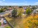 Aerial view showcasing the house, expansive backyard, pool, and surrounding neighborhood at 942 N Miramar --, Mesa, AZ 85213